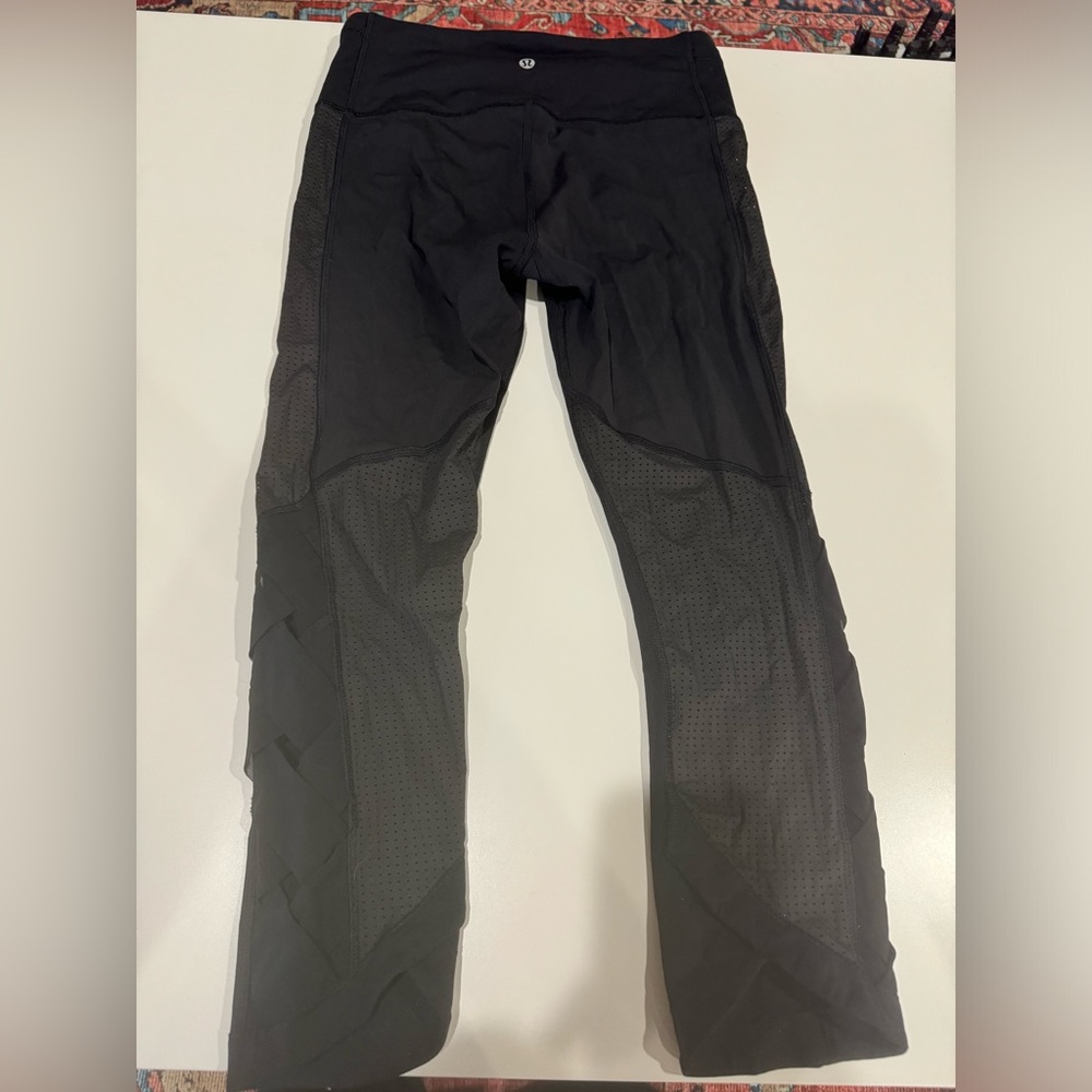Black lulu lemon leggings with detailing on sides